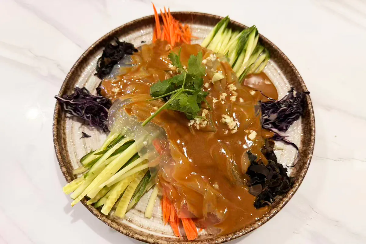 Shredded cucumber, Shredded purple cabbage, shredded wood ear mushrooms, shredded carrots, and clear noodles in savory seasame sauce at Chef Ma，a Chinese Restaurant in Edison